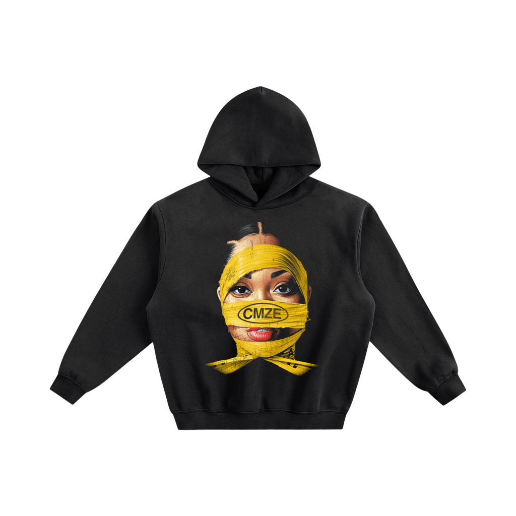 Black hoodie with a graphic of a face with a yellow bandage and 'CMZE' text on a white background