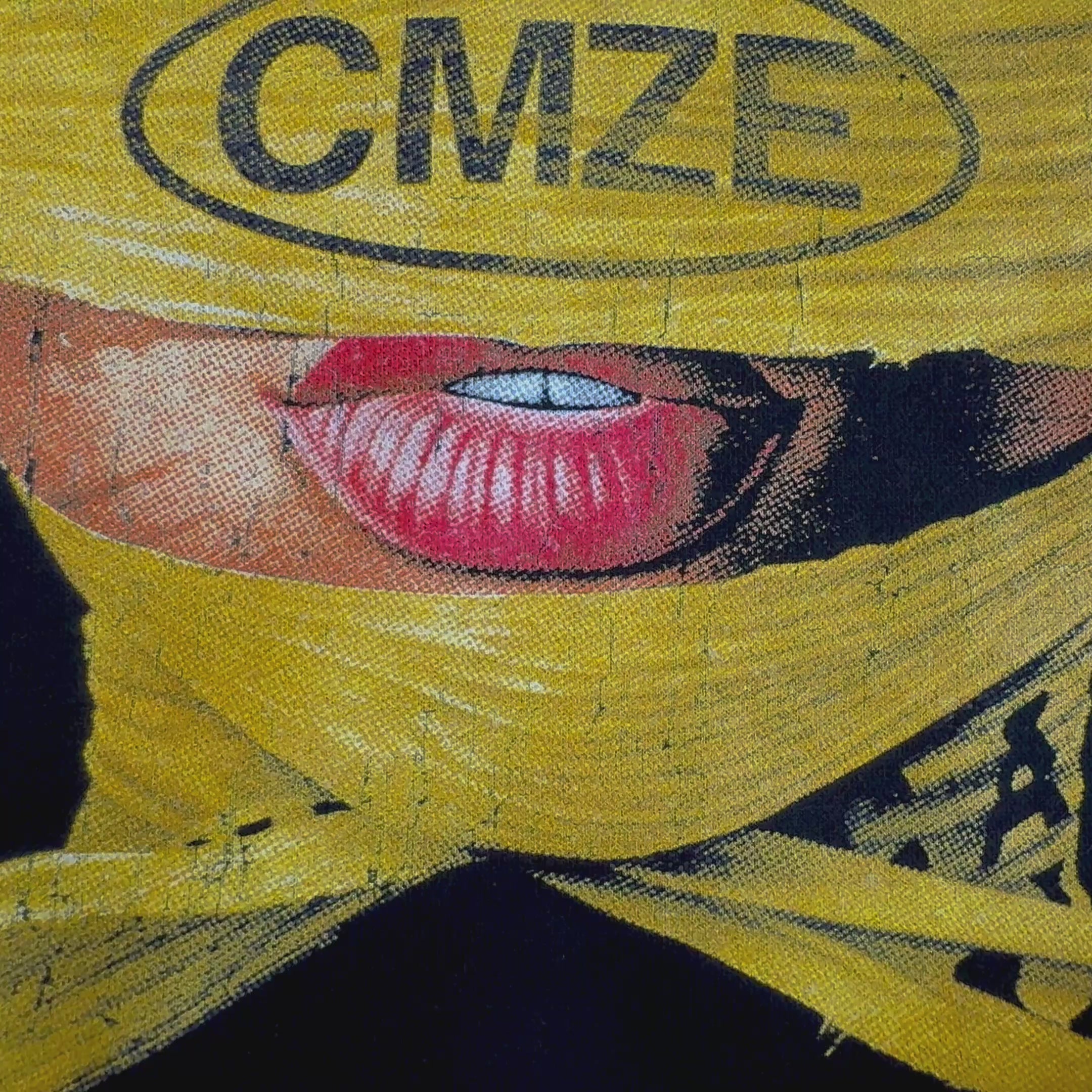 Video of a jumper with a yellow wrap design featuring the CMZE logo