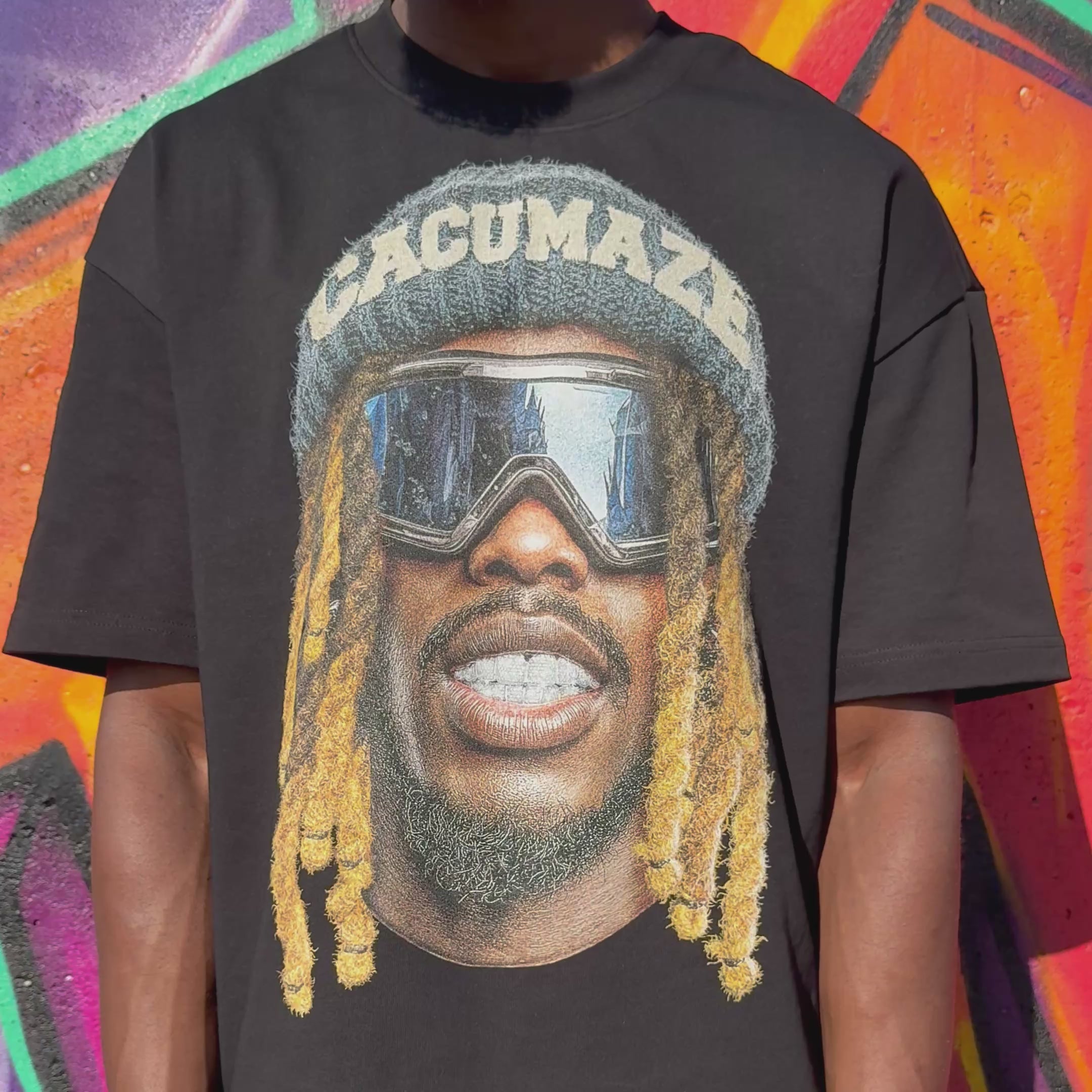 Video showing person wearing a black tshirt with 'CACUMAZE' written on it 